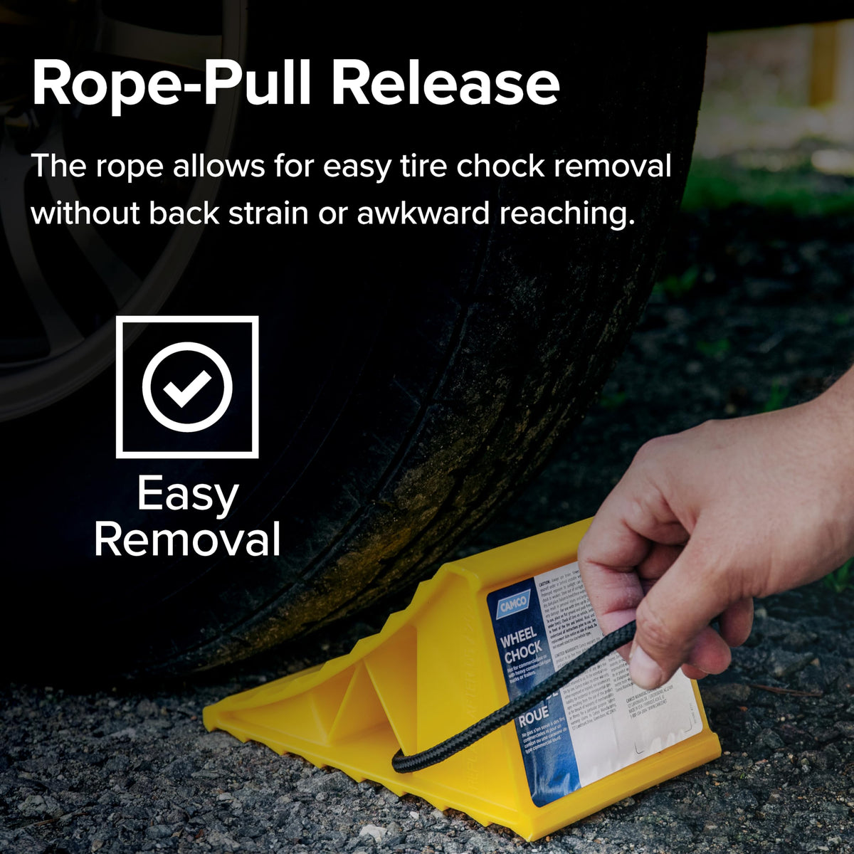 Camco chock in use under trailer wheel providing visible stability