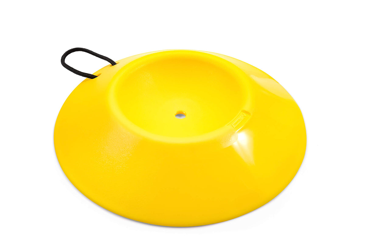 Camco wheel dock beside a hand to show compact size and portability benefit
