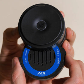 Capri Blue refill next to credit card showing compact size and portability
