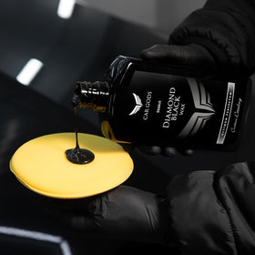 Car Gods in-use wiping on car panel with applicator demonstrating easy application and quick results