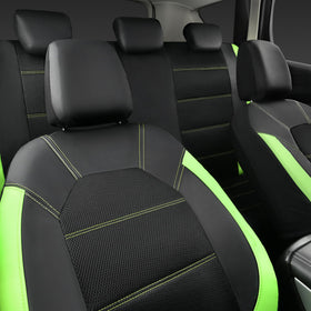 CAR PASS seat covers next to steering wheel for scale showing coverage and fit