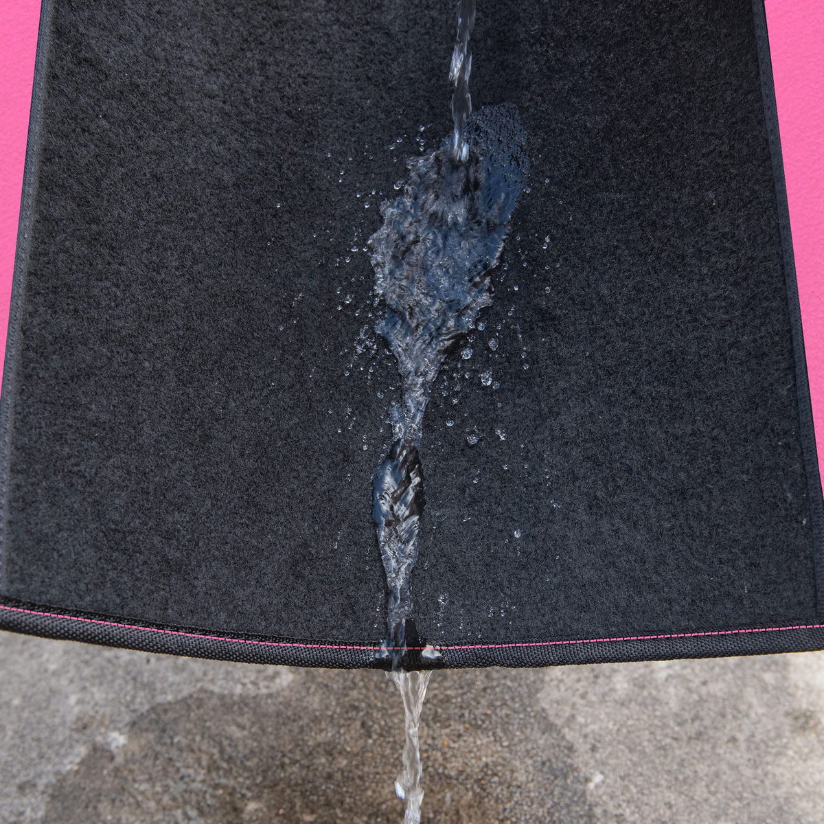 CAR PASS mat under running water showing waterproof easy-clean benefit