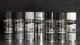 CAR-REP 2K next to hand for scale showing compact 11oz aerosol convenience benefit
