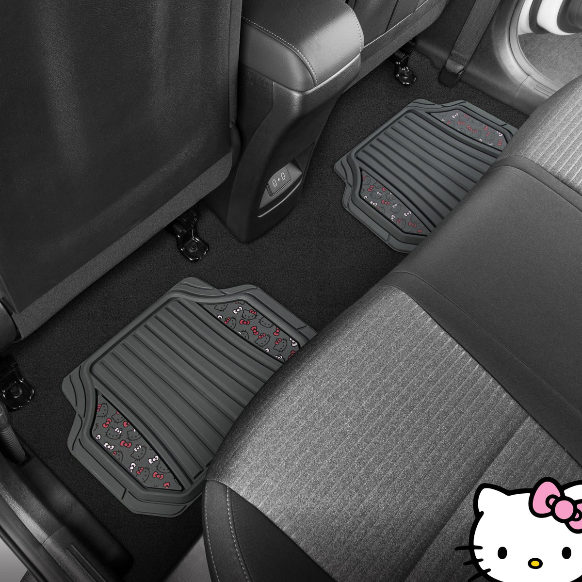 Carbella Hello Kitty mat being rinsed with hose showing easy-clean maintenance advantage