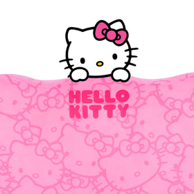 Carbella Hello Kitty next to ruler shows compact size and portability