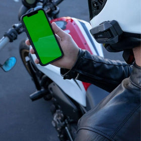Cardo PACKTALK Edge mounted on a motorcycle helmet providing secure communication