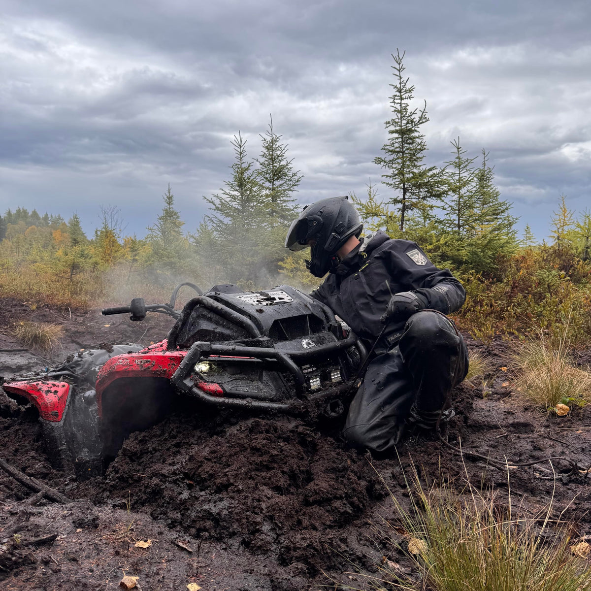 Cardo PACKTALK Edge ORV in hand for size comparison showing compact portability benefit