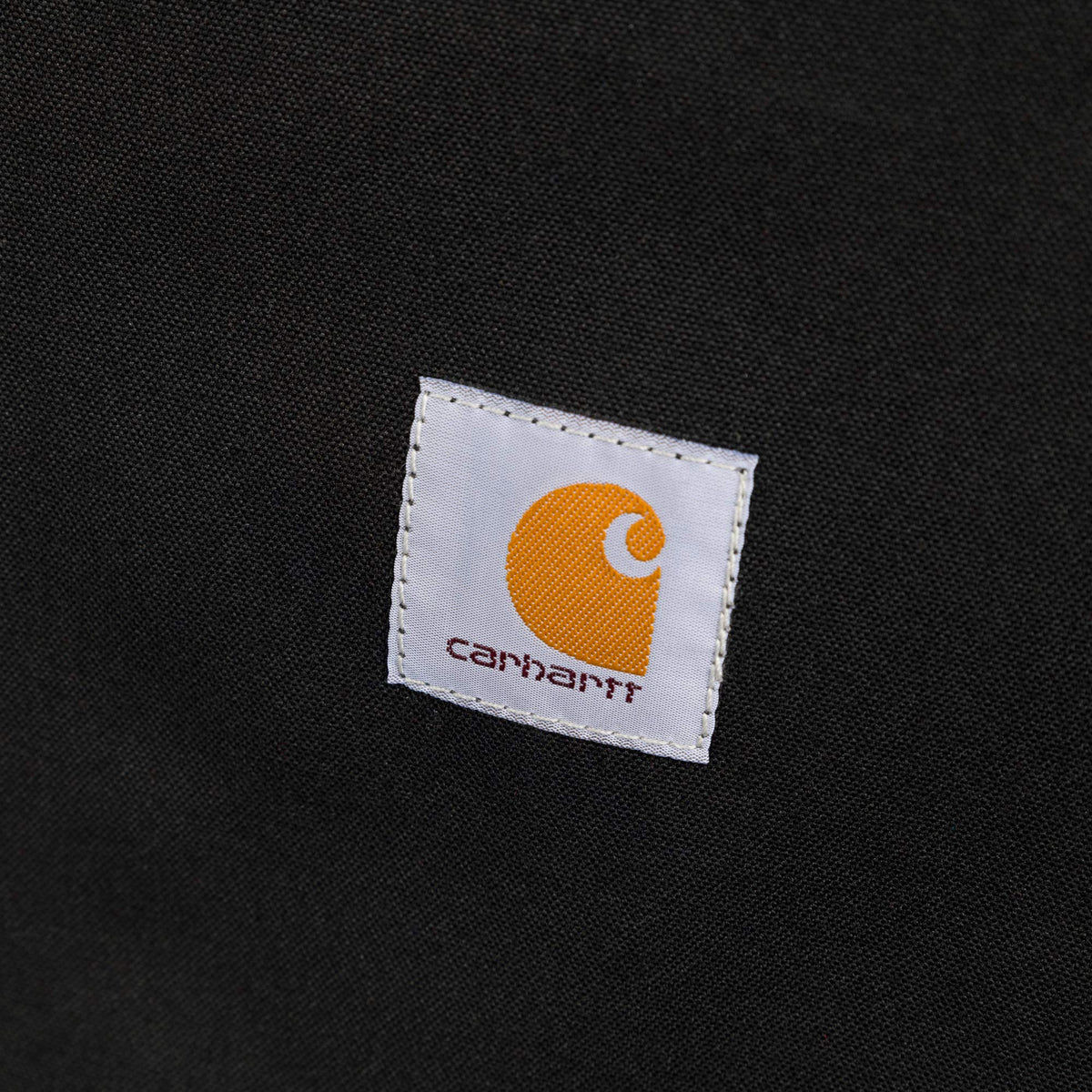 Carhartt close-up Cordura texture showing water-repellent finish and durability