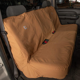 Carhartt bench seat in worksite truck interior illustrating protection during heavy use benefit