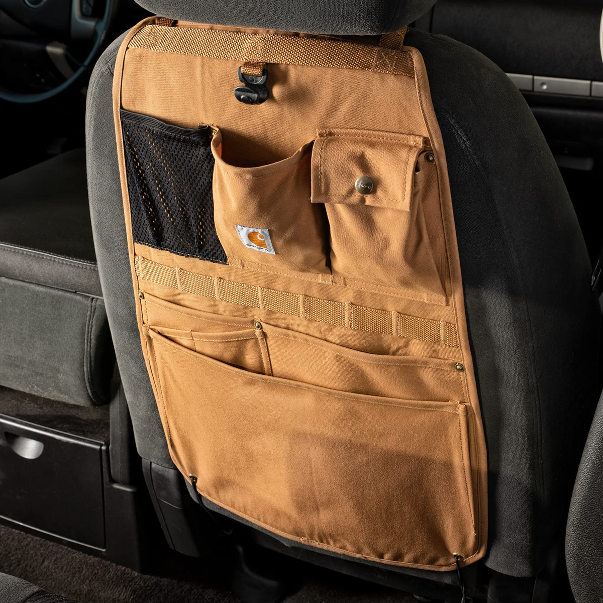 Carhartt organizer next to tools to show scale and capacity for worksite gear