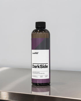 CARPRO DarkSide water beading on treated rubber showing hydrophobic dirt-shedding benefit