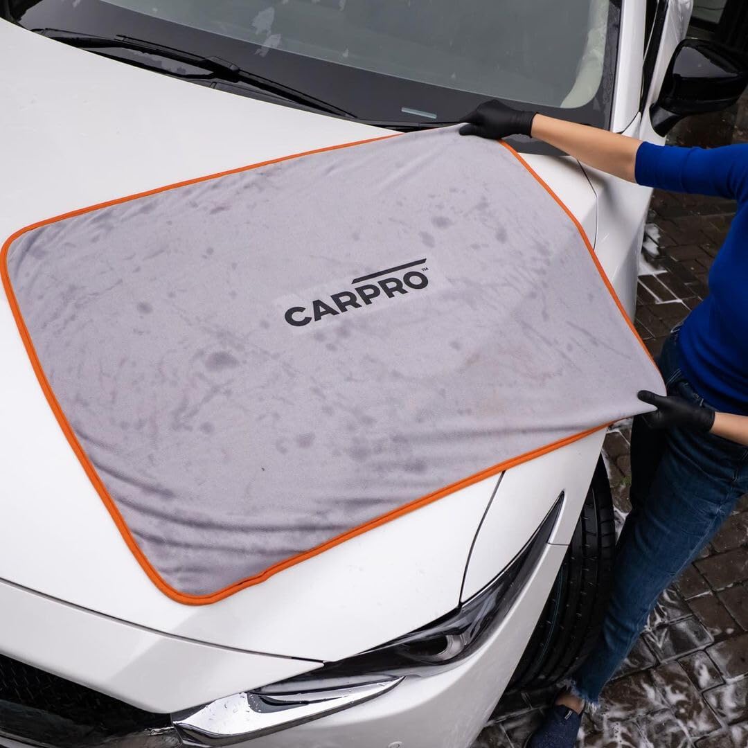 CARPRO DHydrate held in hand to show 28x40 inch scale and coverage