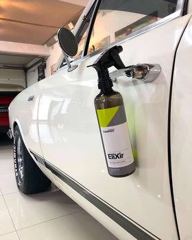 CARPRO Elixir being wiped with microfiber showing quick, streak-free application
