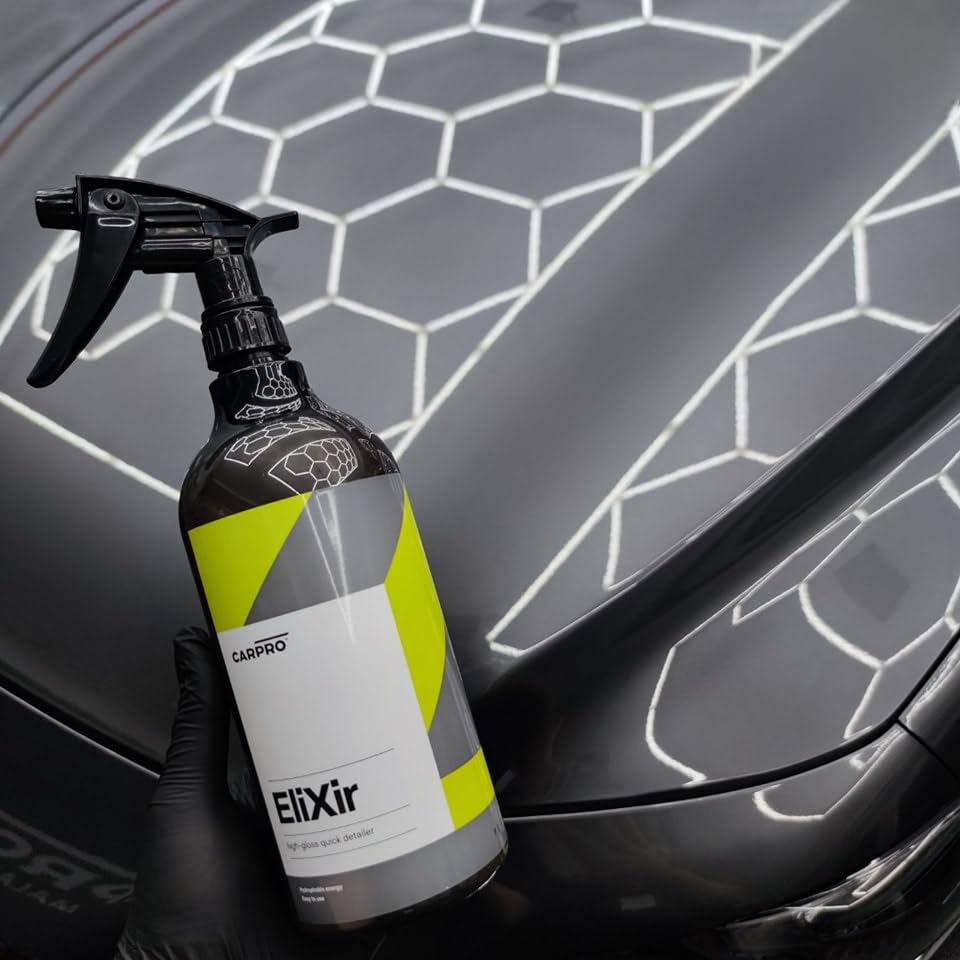 CARPRO EliXir being wiped with a microfiber to demonstrate streak-free buffing