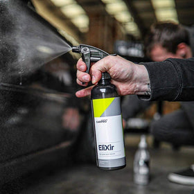 CARPRO Elixir wipe revealing deep gloss and enhanced paint clarity benefit