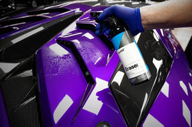 CARPRO Eraser 1L bottle beside a hand for size and scale reference