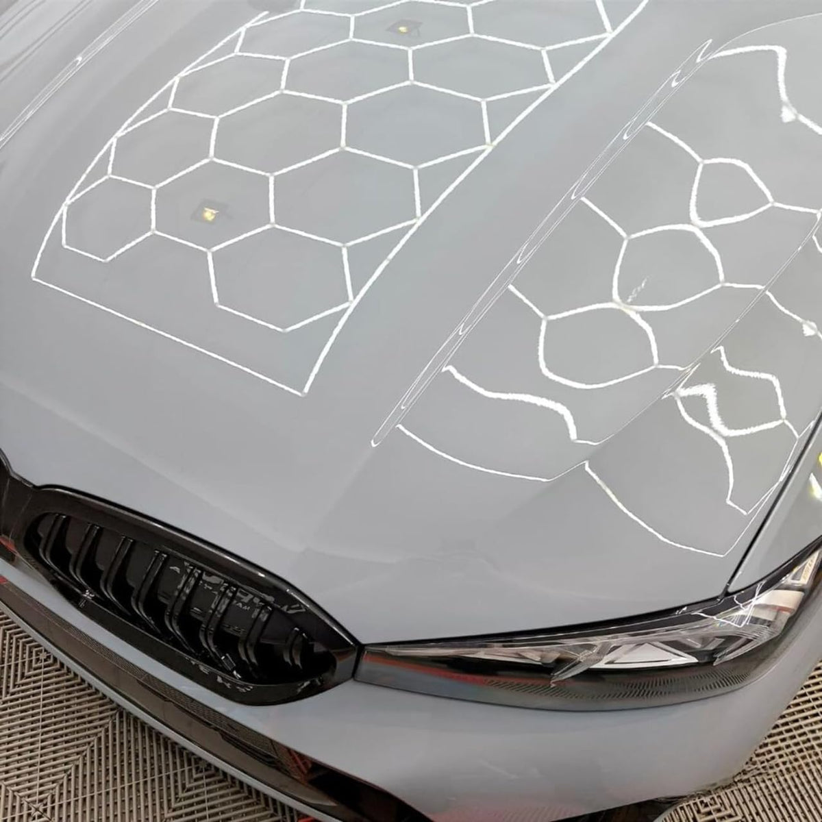CARPRO Essence before and after panel showing reduced swirls and improved clarity