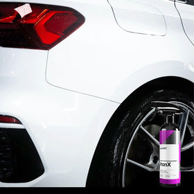 CARPRO IronX bottle beside ruler indicating 500mL scale and portability