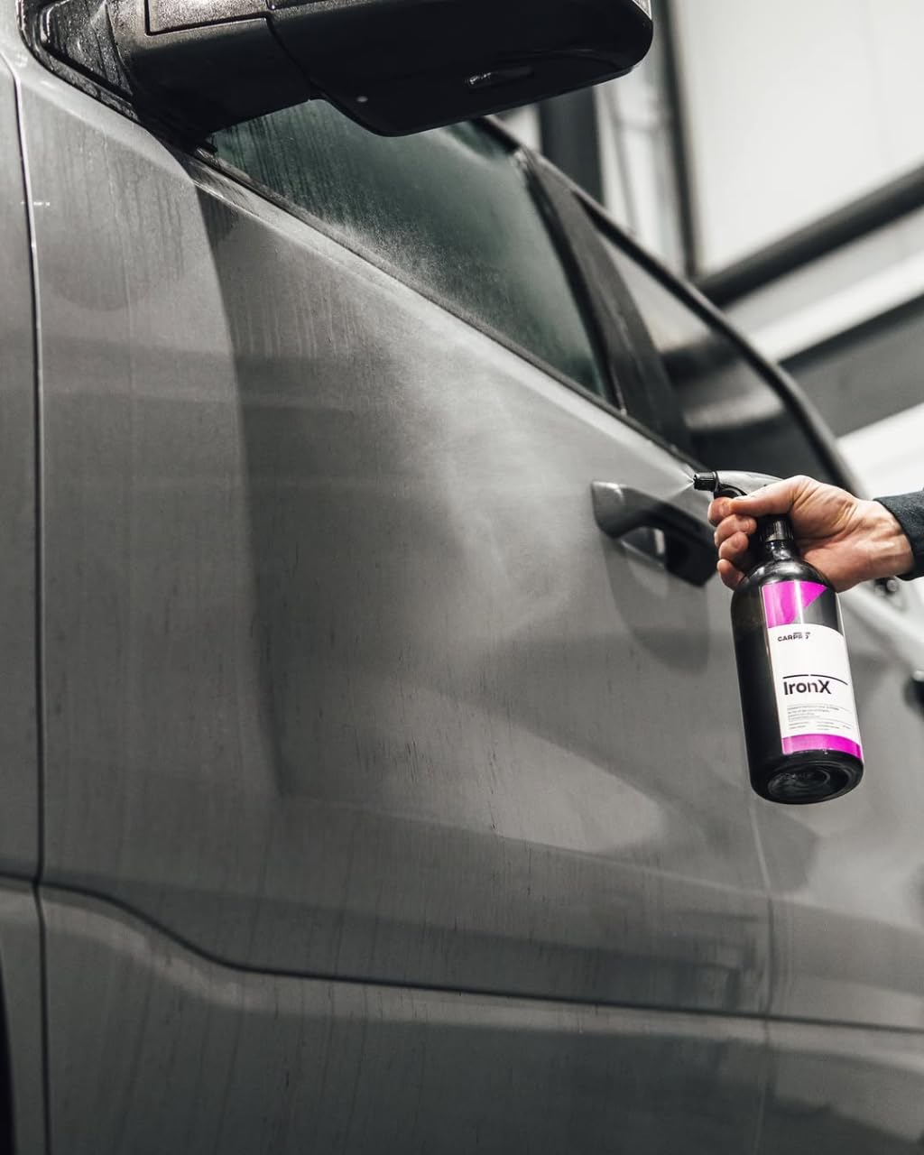 CARPRO IronX solution pouring from bottle to measure correct dosage