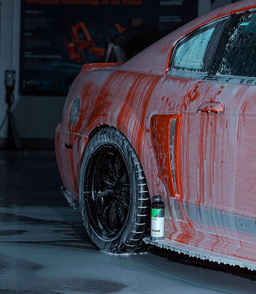 CARPRO Reset applied on coated car panel showing coating-safe cleaning benefit