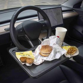 CarQiWireless front view on Tesla wheel showing secure fit and convenience