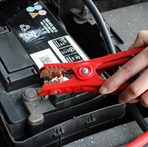 CARTMAN cables connected to a car battery demonstrating reach and ease