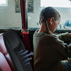 CARTMAN lifestyle image of driver relaxed using cushion for cooler rides