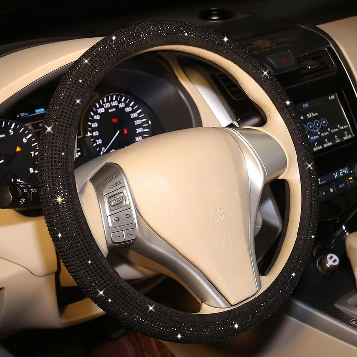 Carwales front view of black rhinestone steering wheel cover showing elegant design and fit