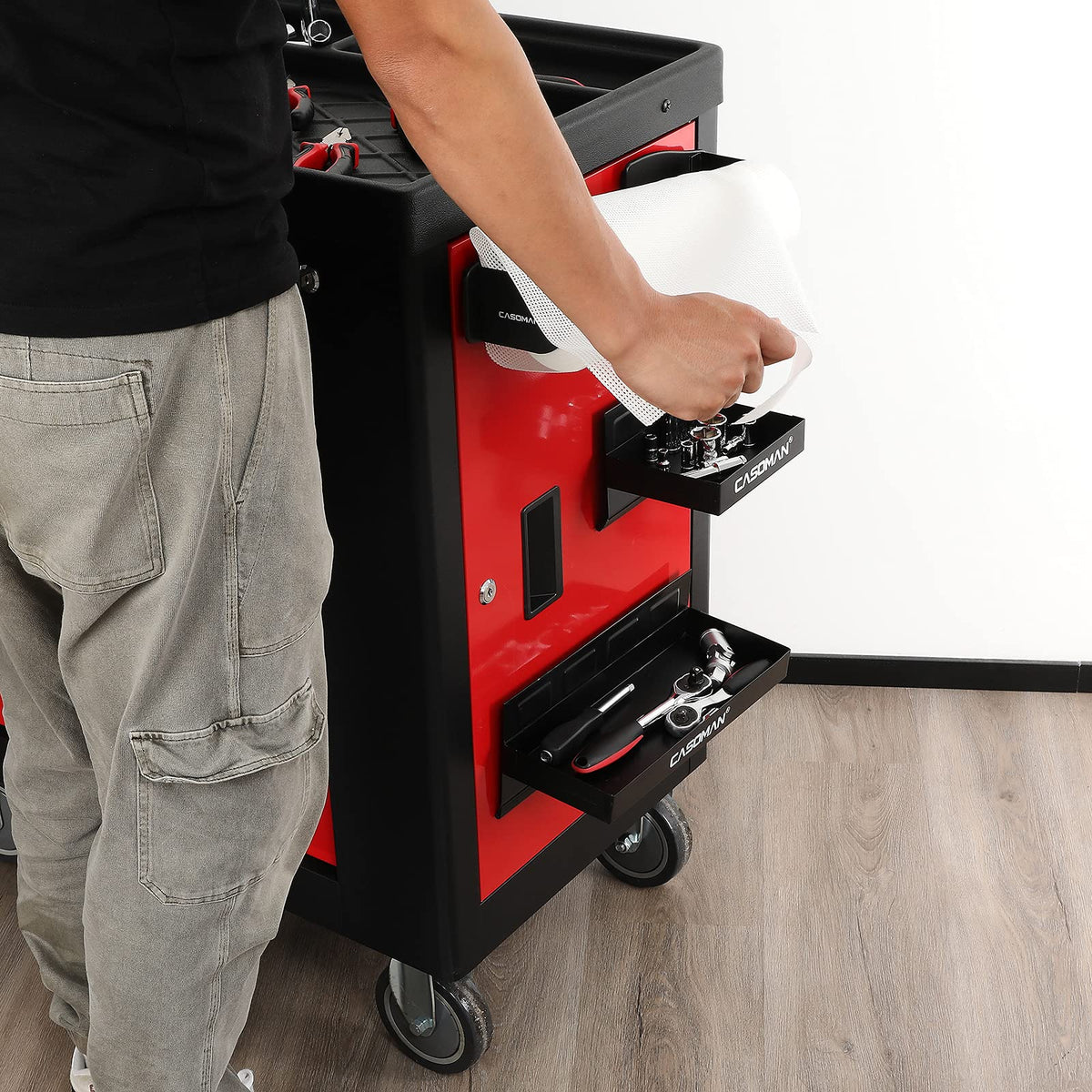 CASOMAN tray next to hand showing scale and easy portability