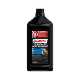 Single Castrol Transmax quart beside a wrench to show bottle size and workshop scale