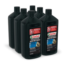 Castrol Transmax Import bottles on garage workbench ready for multi‑vehicle maintenance