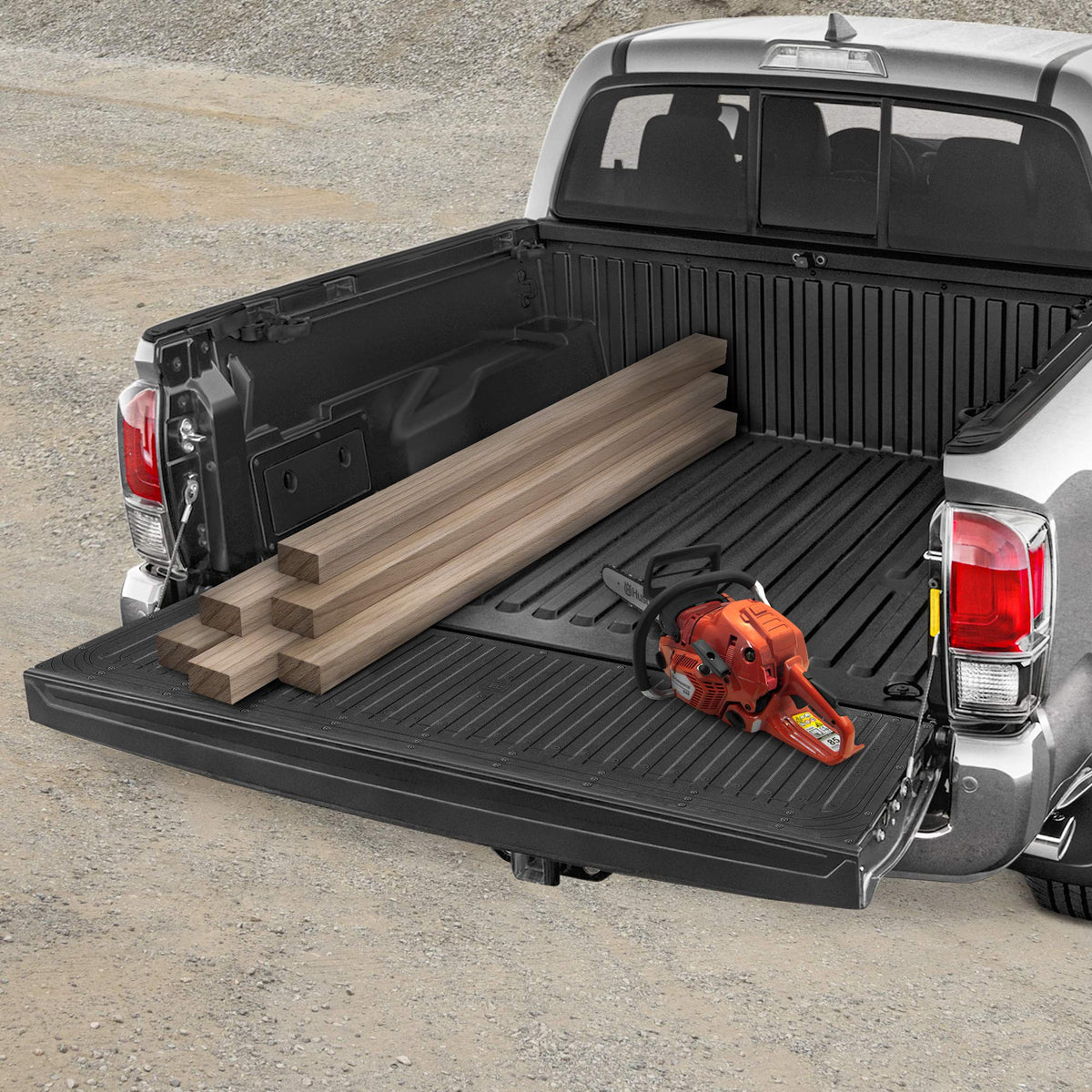 CAT tailgate mat in a worksite setting demonstrating rugged everyday use