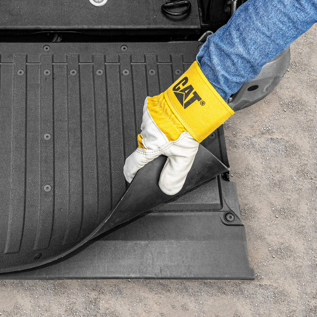CAT mat edge with trim line indicating easy custom fit for various tailgates