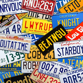 Celebrity Machines plate in garage setting enhancing a retro automotive display