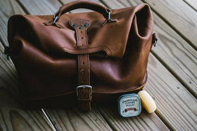 Before and after leather strap treated with Chamberlain's Leather Milk, shows visible scratch reduction