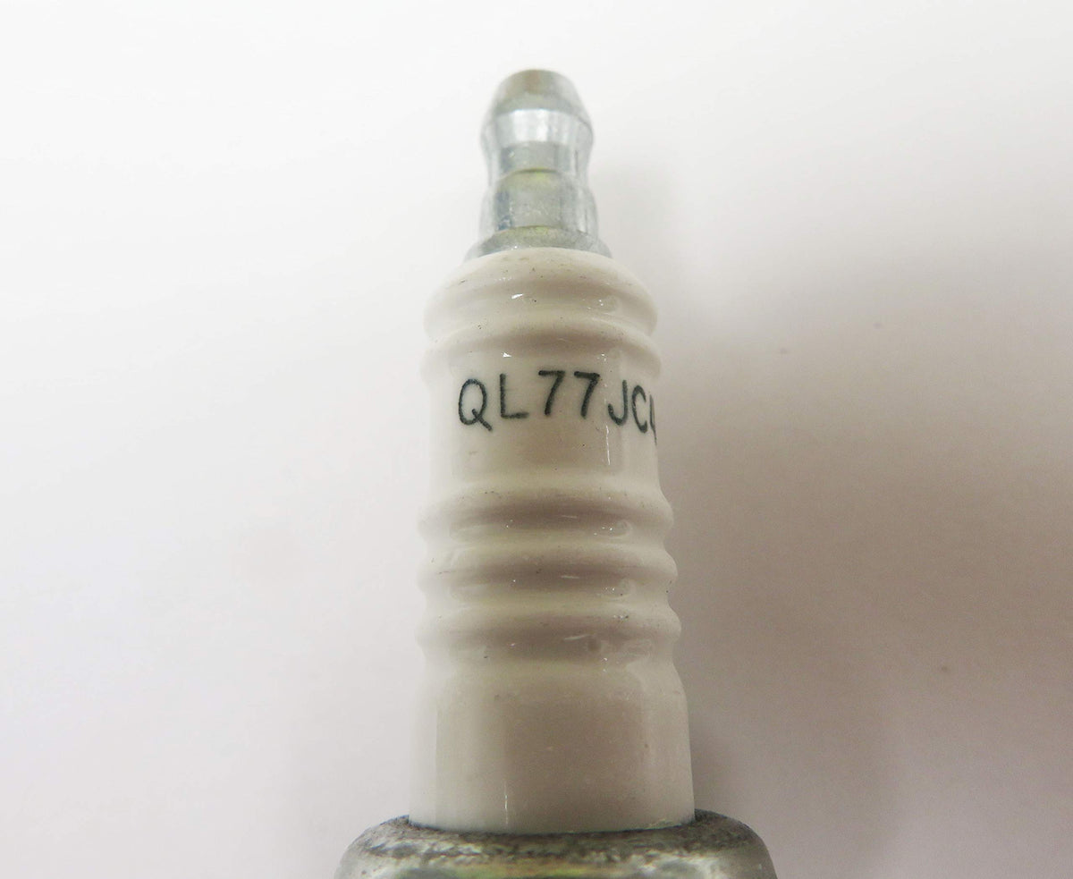 beseloa Champion QL77JC4 next to ruler showing 14mm thread and 12.7mm reach for correct fit verification