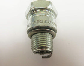 beseloa Champion QL77JC4 installed in outboard motor during maintenance showing reliable ignition replacement