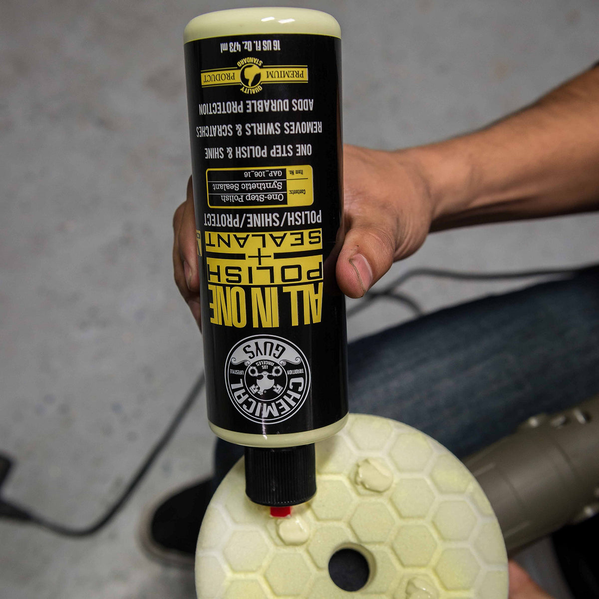Chemical Guys applying product by hand with foam pad for time-saving correction