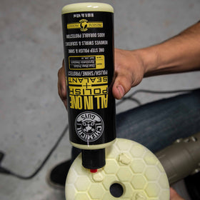 Chemical Guys applying product by hand with foam pad for time-saving correction
