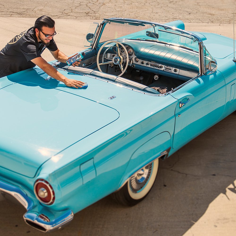 Chemical Guys applying wax on car door for smooth, streak-free finish benefit