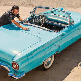Chemical Guys applying wax on car door for smooth, streak-free finish benefit