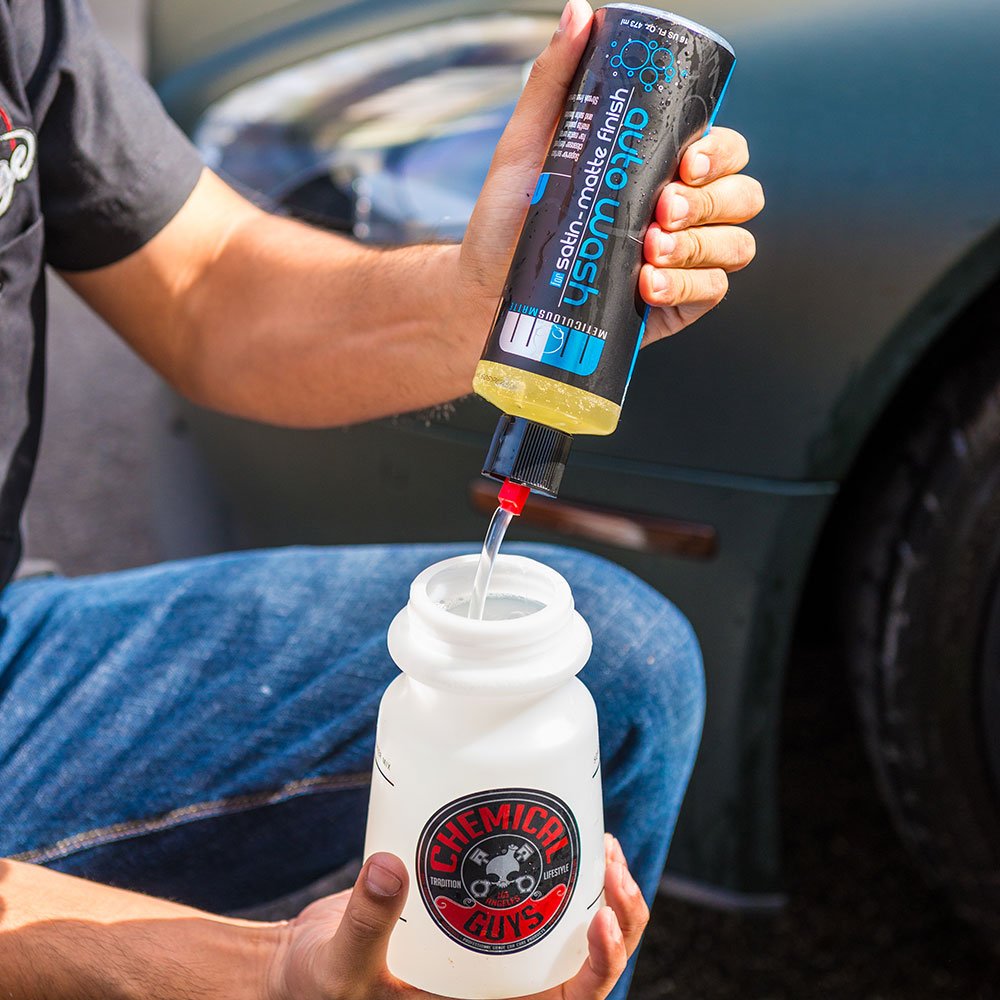 Chemical Guys half-gallon bottle held in hand illustrating quantity and value
