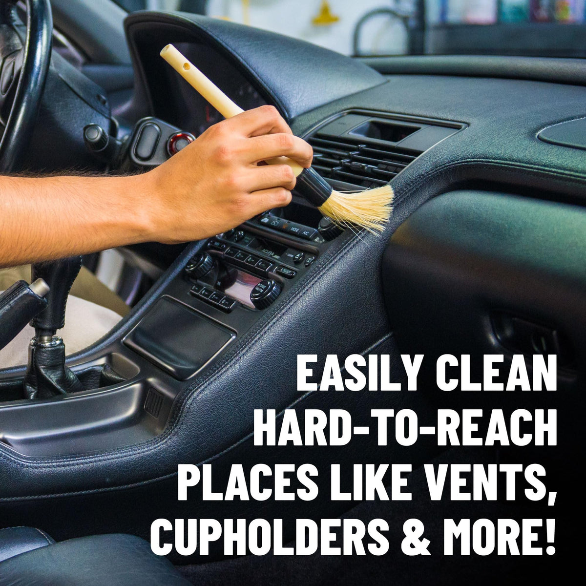 Chemical Guys brush cleaning car vent, lifts dust from tight crevices