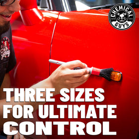 Chemical Guys brushes held in hand to show scale and comfortable lightweight grip