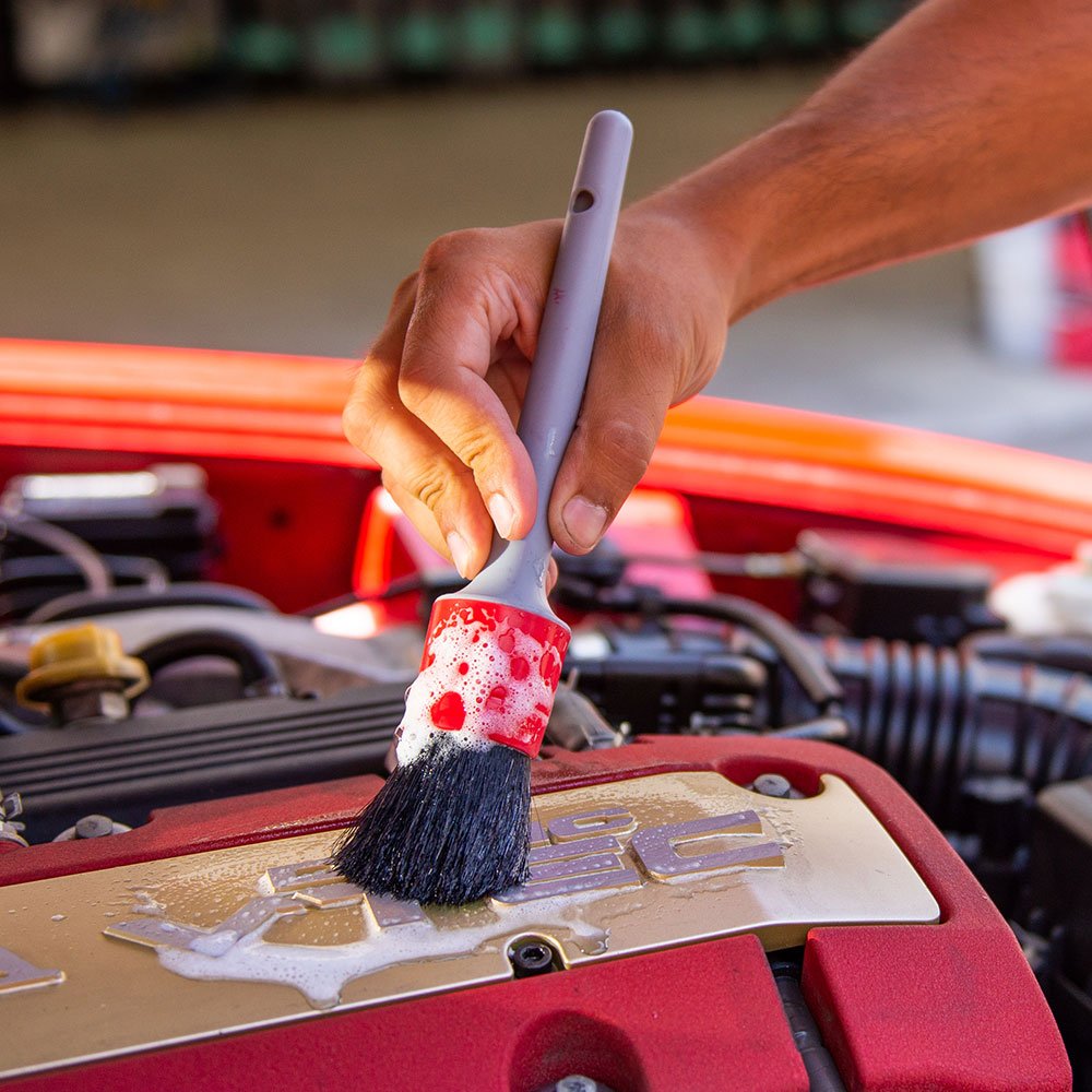 Chemical Guys brush cleaning wheel spokes and lug nut pockets to remove brake dust
