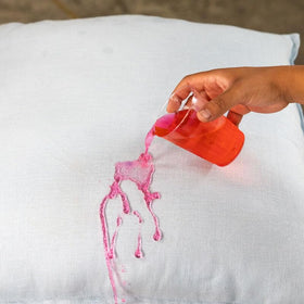 Chemical Guys fabric beading image showing spilled liquid beaded for quick cleanup