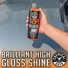 Chemical Guys Hybrid V7 bottle staged beside clean car illustrating show-ready finish