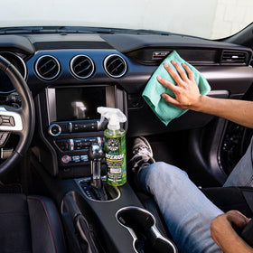 Chemical Guys HydroInterior being sprayed onto a microfiber towel for safe application