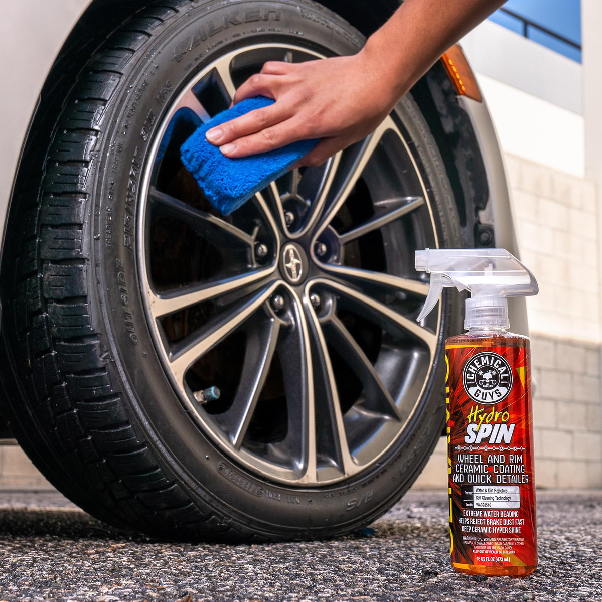 Chemical Guys HydroSpin 16 oz bottle beside a hand for scale showing travel-friendly size benefit