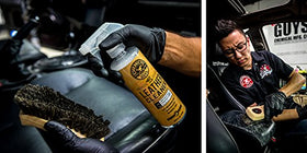 Chemical Guys brush cleaning car seat seam demonstrating deep-cleaning benefit without damage